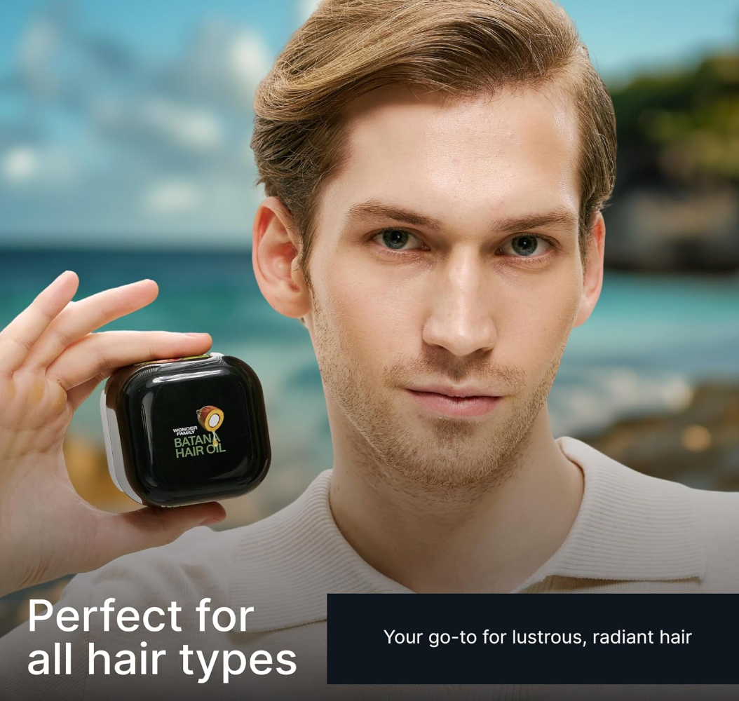 Man holding the Raw Batana Oil jar, showing its packaging against a beach background with a full set of hair.